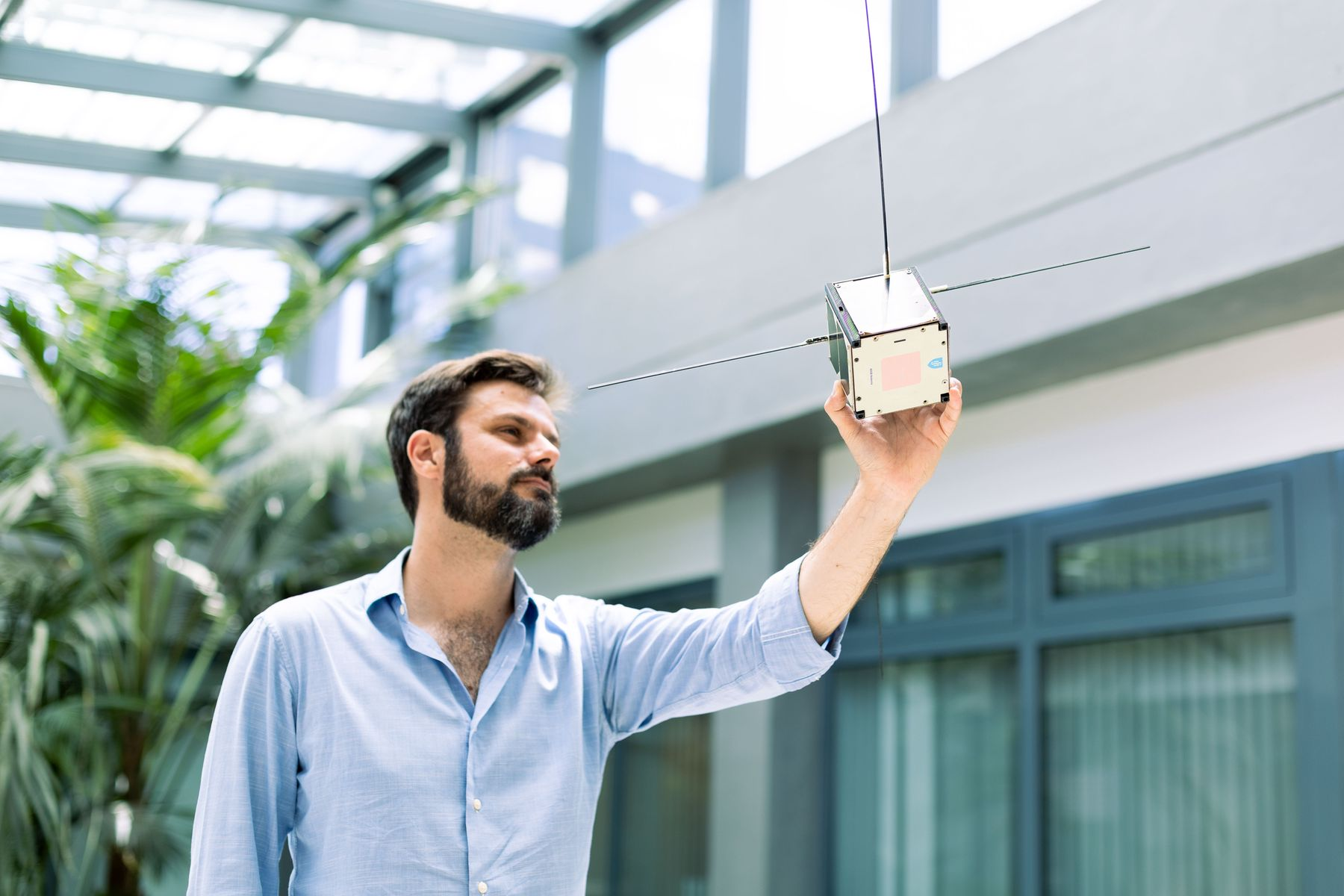 Researcher with satellite