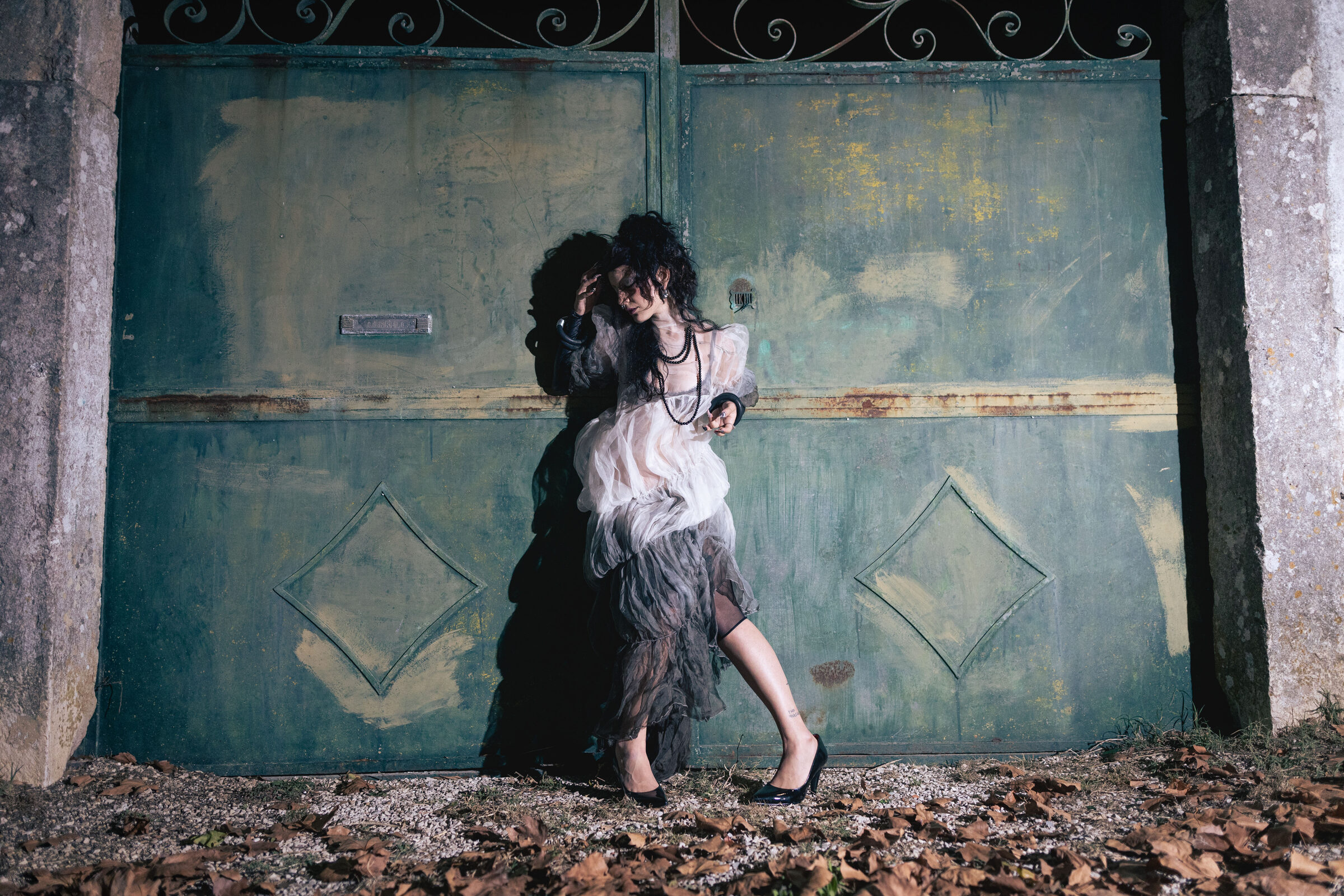 Fashion Editorial - Against green iron gate
