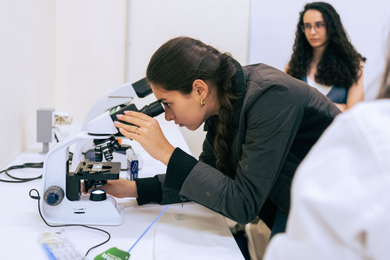 Student using microscope in lab
